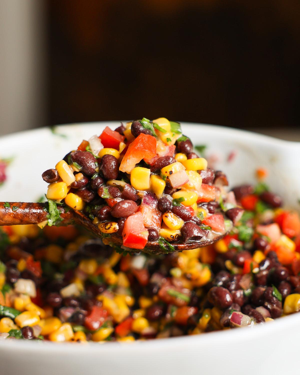 Close-up shot of a serving of Spicy Wheat Salad with Black Beans and Corn, showing the texture and ingredients.