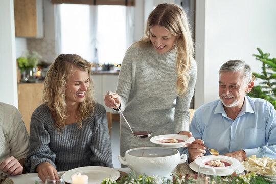 family eating soup together at the table