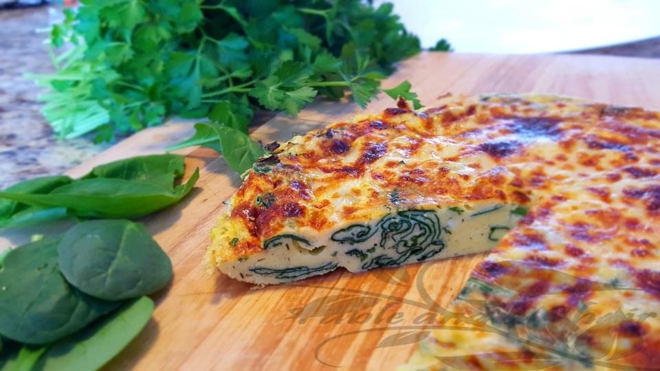 ingredients for spinach and ricotta frittata arranged on a wooden countertop