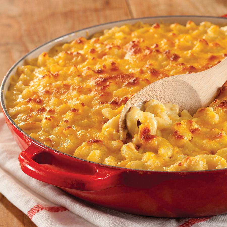 ingredients for extra cheesy macaroni and cheese laid out on a wooden surface
