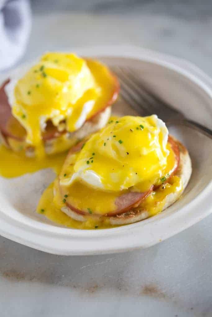 Assembled eggs benedict with hollandaise sauce