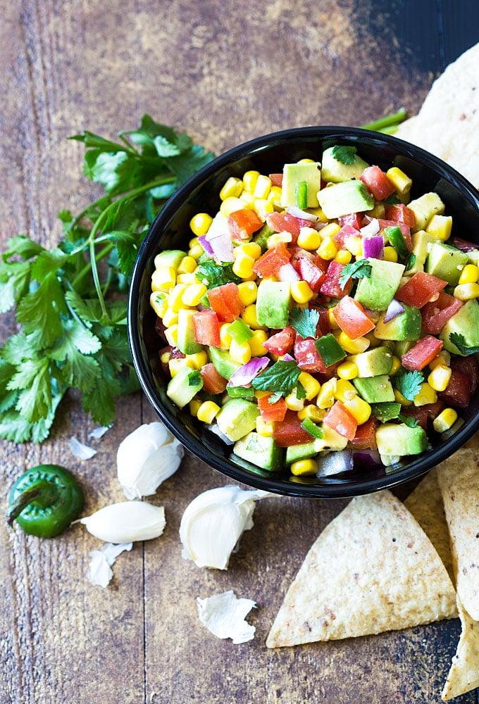 overhead shot of a bowl of corn and avocado salsa