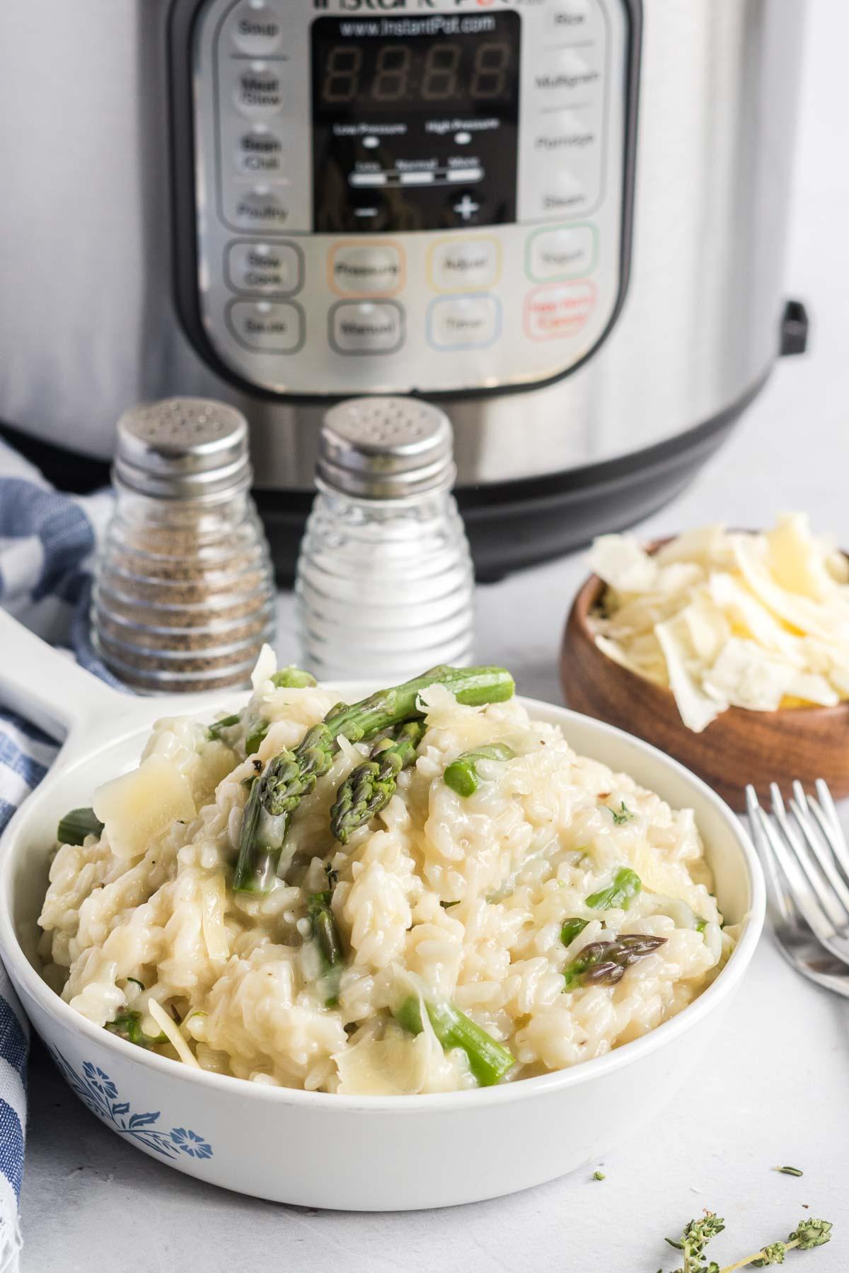 Instant Pot creamy asparagus rice being stirred