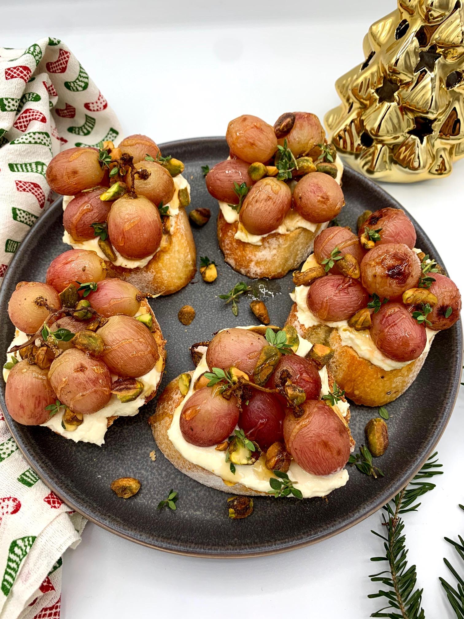 Roasted grape crostini with whipped feta and fresh thyme, elegant appetizer