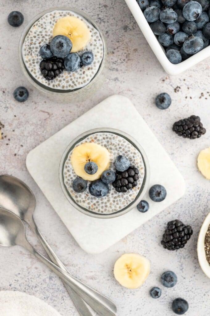 overhead shot of a variety of fresh fruits ready to be added to chia pudding