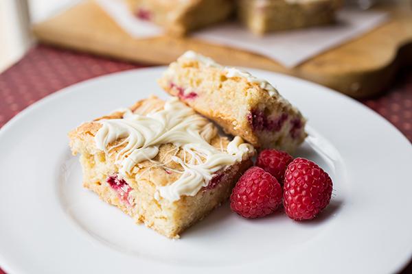 A beautifully styled plate of raspberry blondies