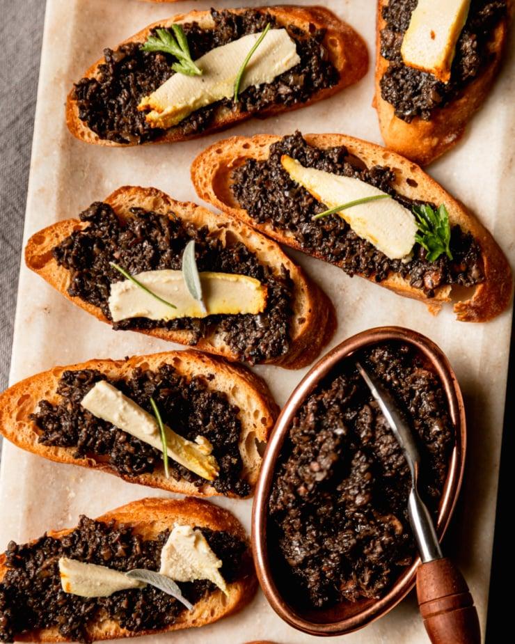 creamy vegan goat cheese with herbs, close up shot
