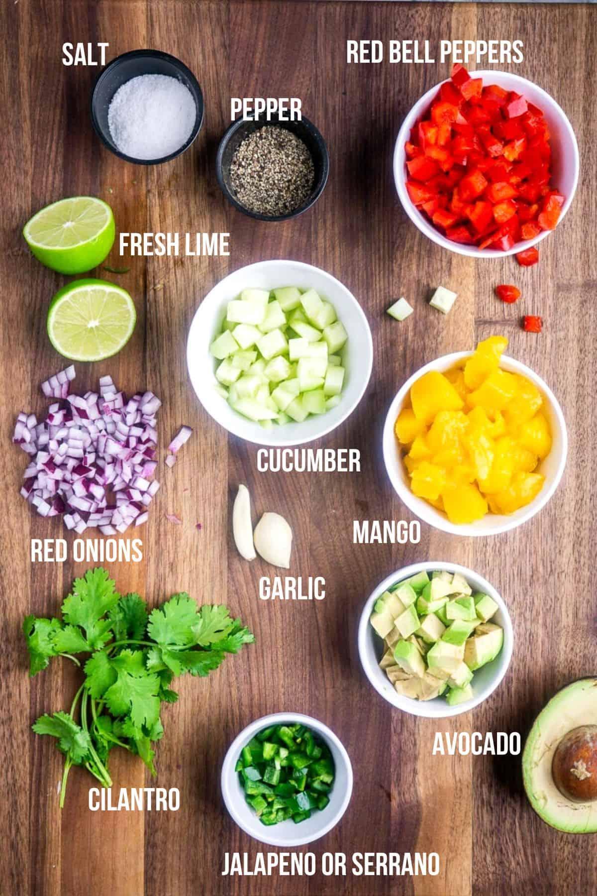 ingredients for mango avocado salsa arranged on a table