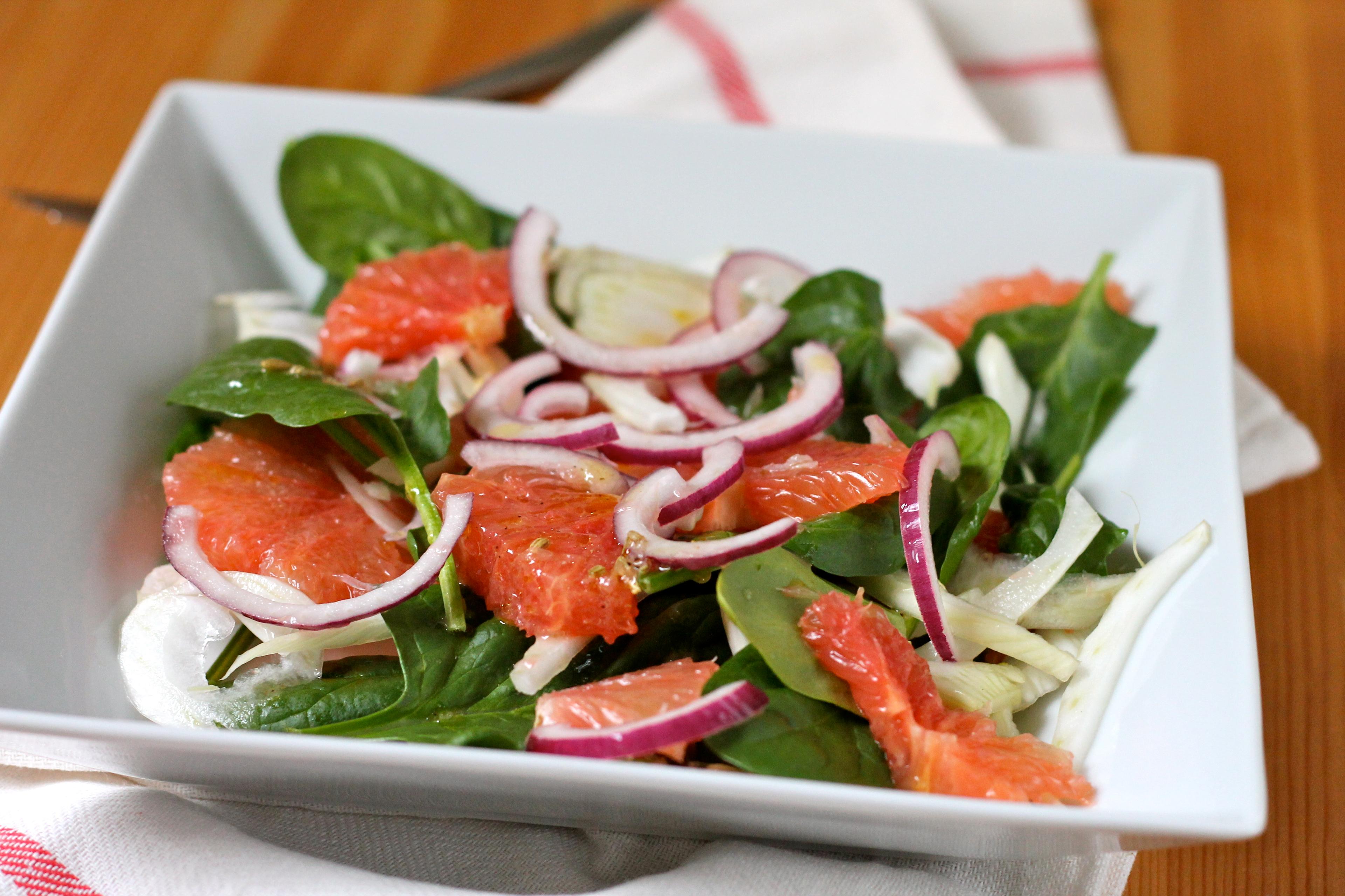 vibrant grapefruit and fennel salad on a rustic wooden table