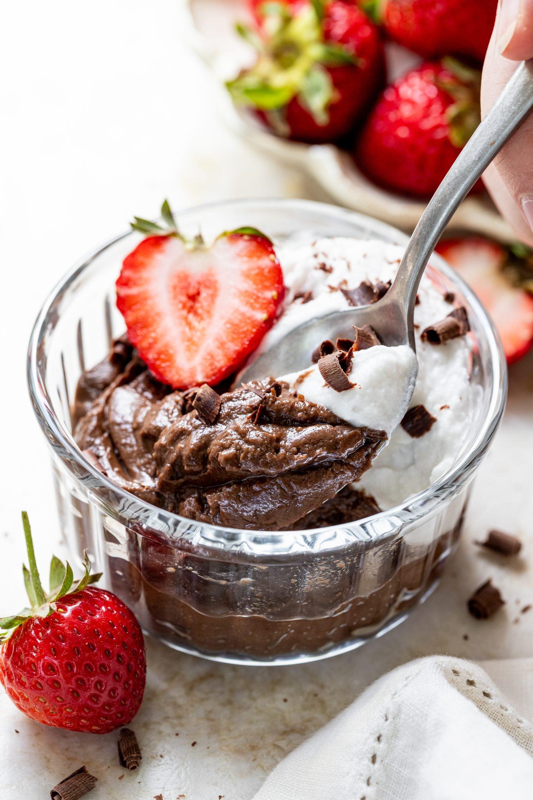 close-up of a smooth and creamy avocado chocolate mousse in a glass bowl