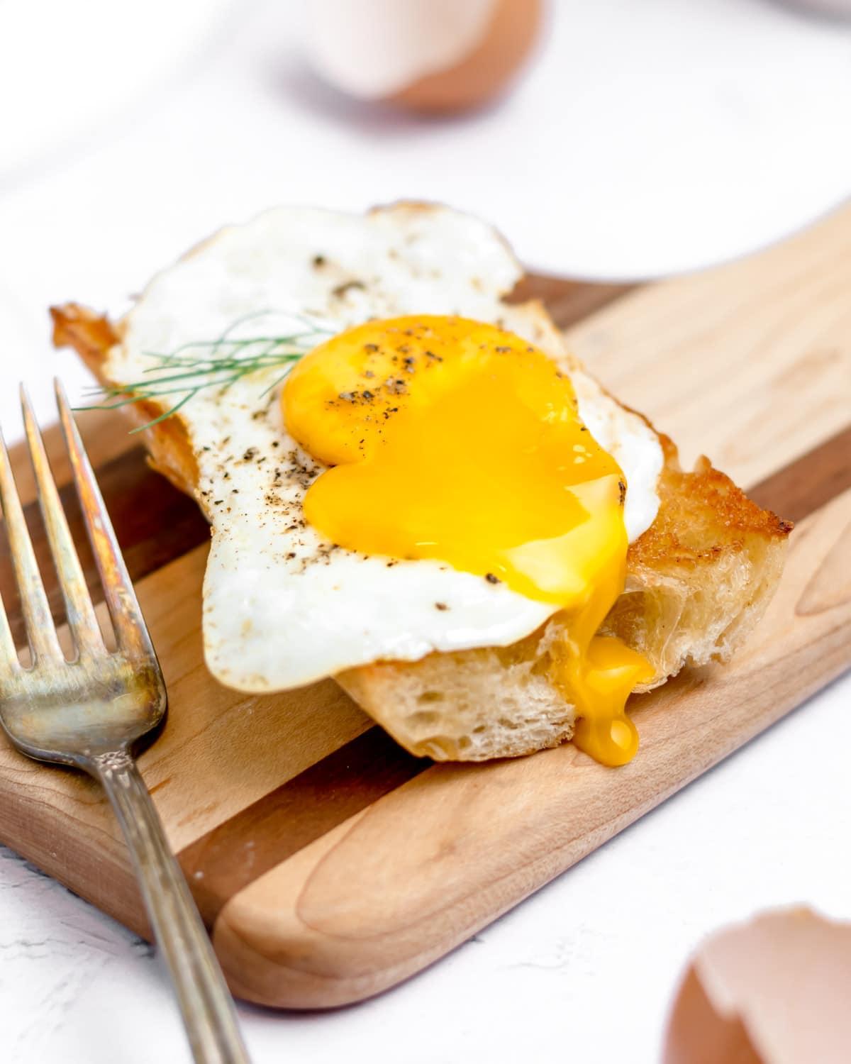 Close-up of a perfectly cooked fried egg with a runny yolk
