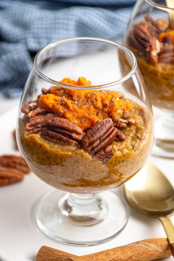 Close-up of sweet potato pie chia pudding with pecan garnish
