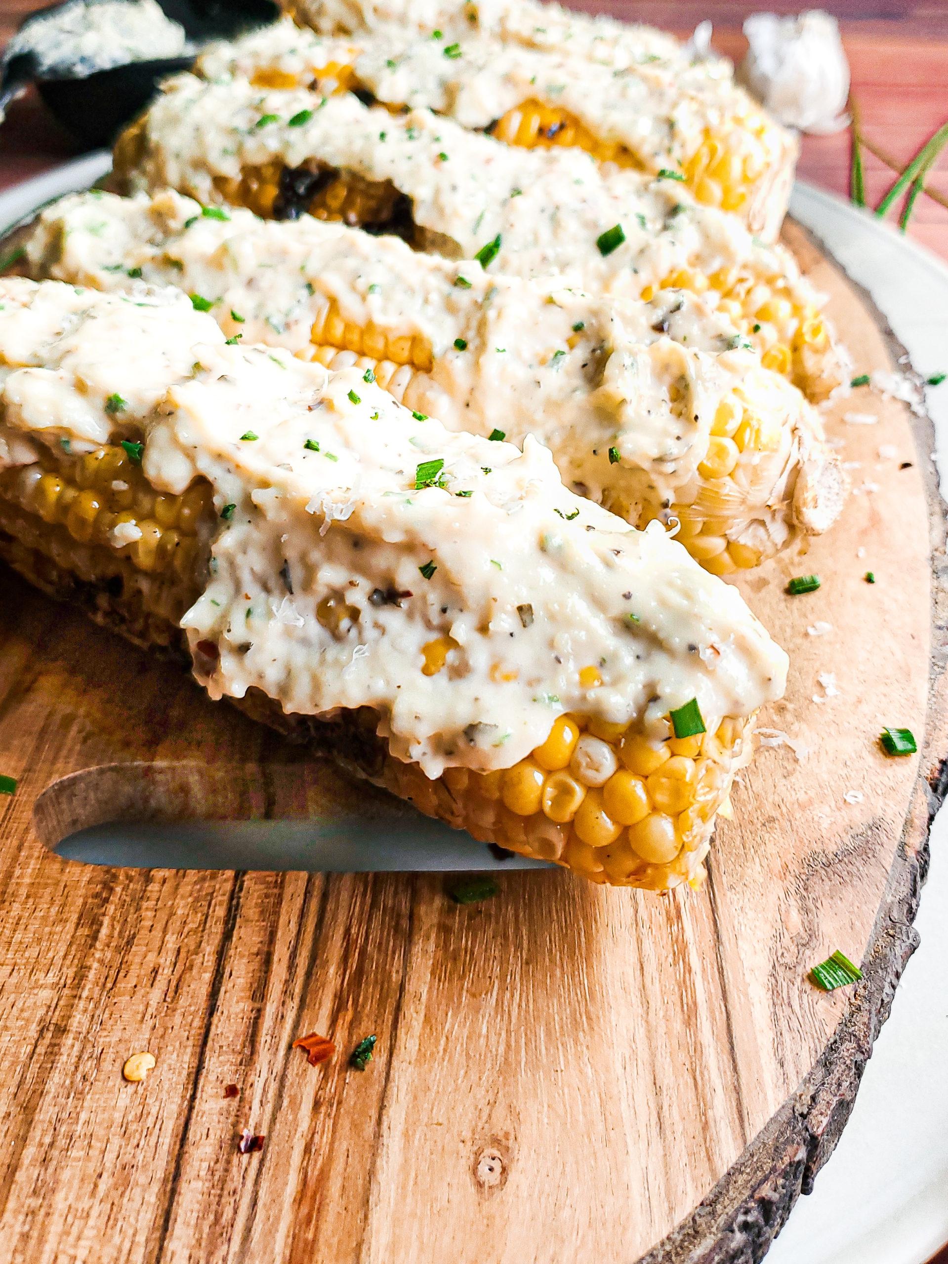 A serving platter of Grilled Corn with Basil Ricotta ready to be served
