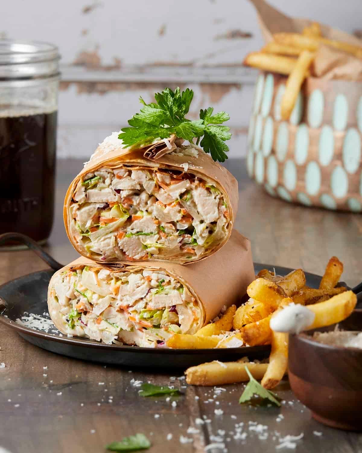 Chicken Caesar Wrap with Parmesan Crisps on a wooden board