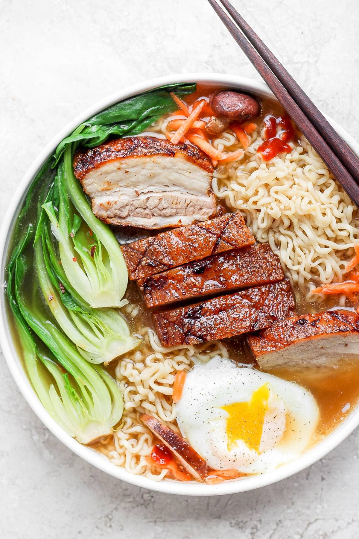 bowl of spicy ramen with pork belly
