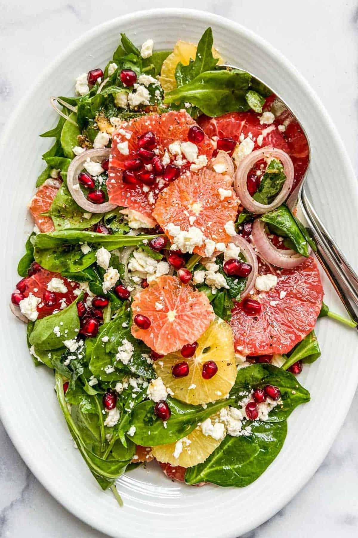 bright and colorful pomelo and pomegranate salad with feta cheese