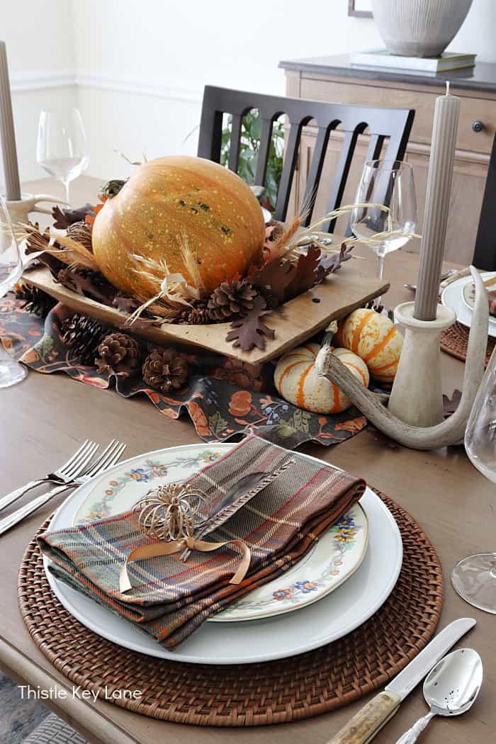 Rustic table setting with a large dish of maple squash gratin as the centerpiece