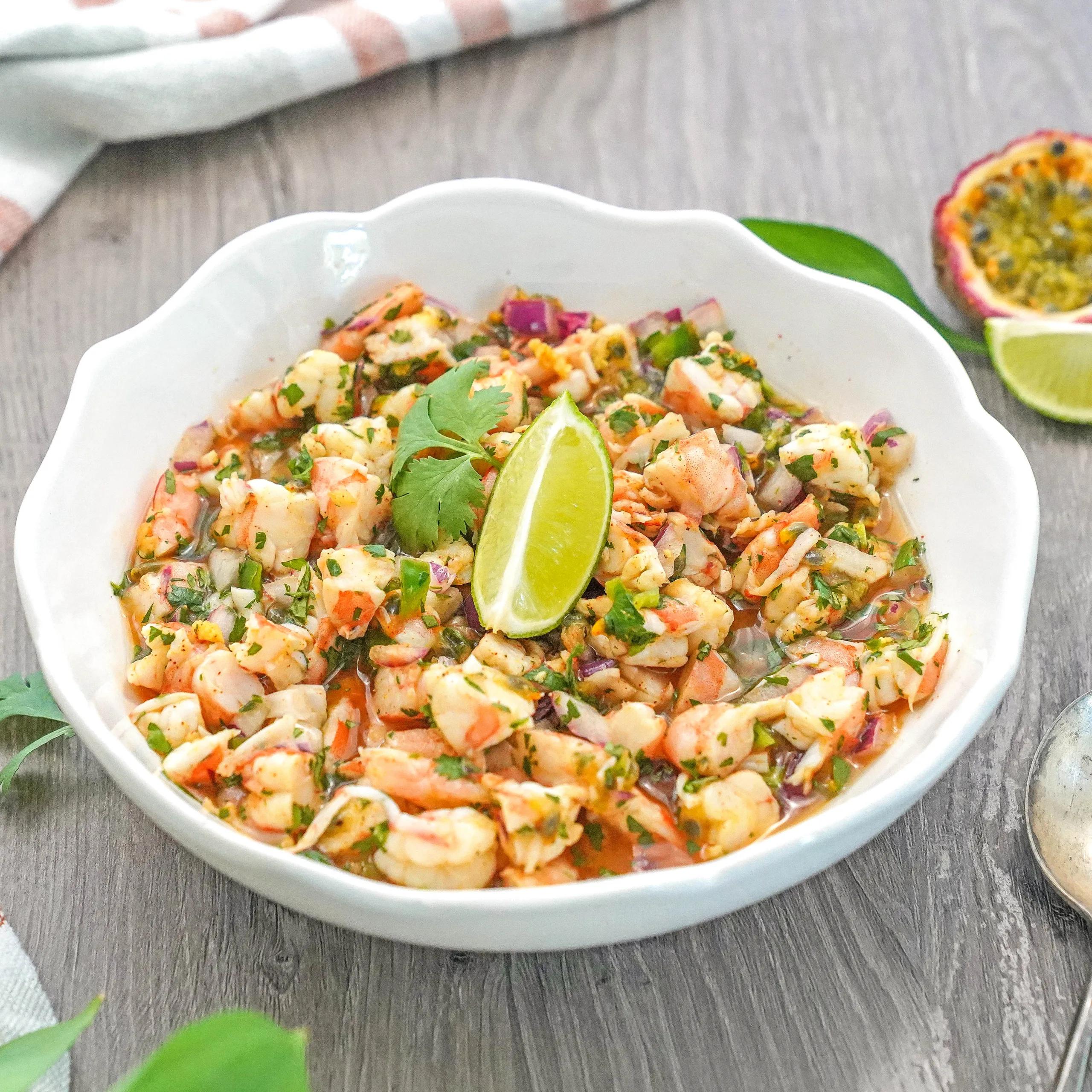 Ecuadorian shrimp ceviche with passion fruit in a vibrant serving dish