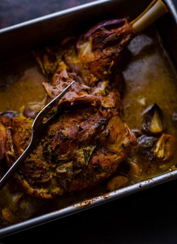 close up of baklava spiced lamb shoulder being seasoned with spices