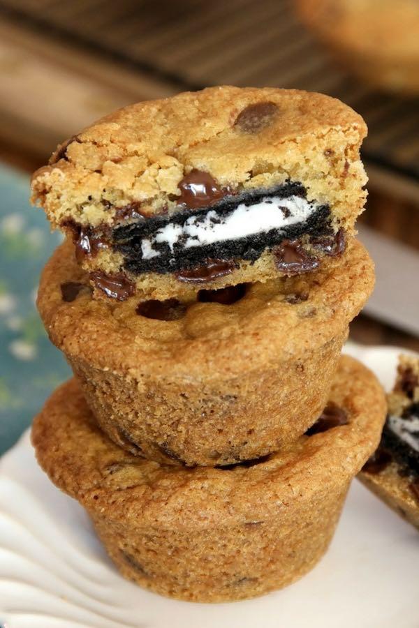 cross-section of a stuffed chocolate cookie muffin showing the melted cookie center