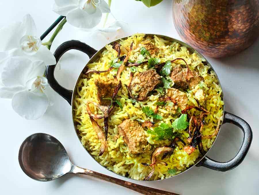 overhead shot of lamb biryani in a pot