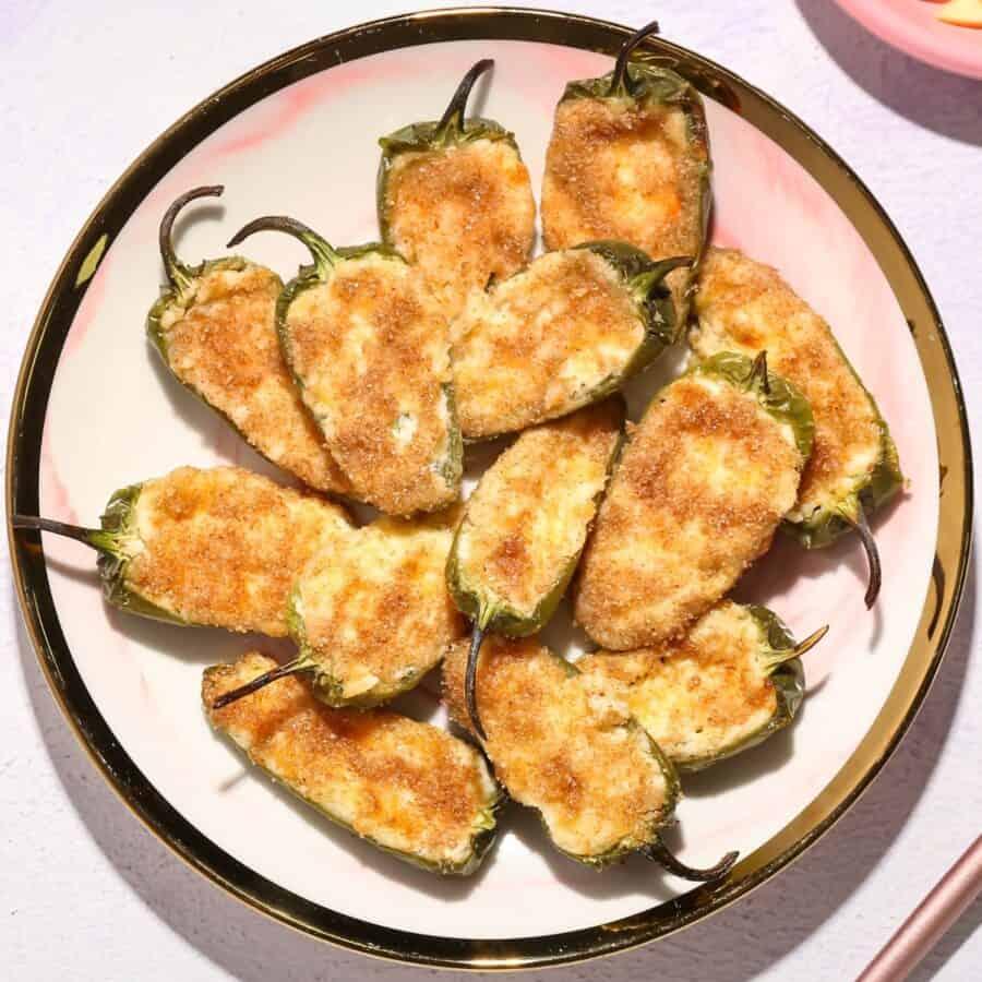 Baked jalapeño poppers fresh out of the oven, cheese slightly browned
