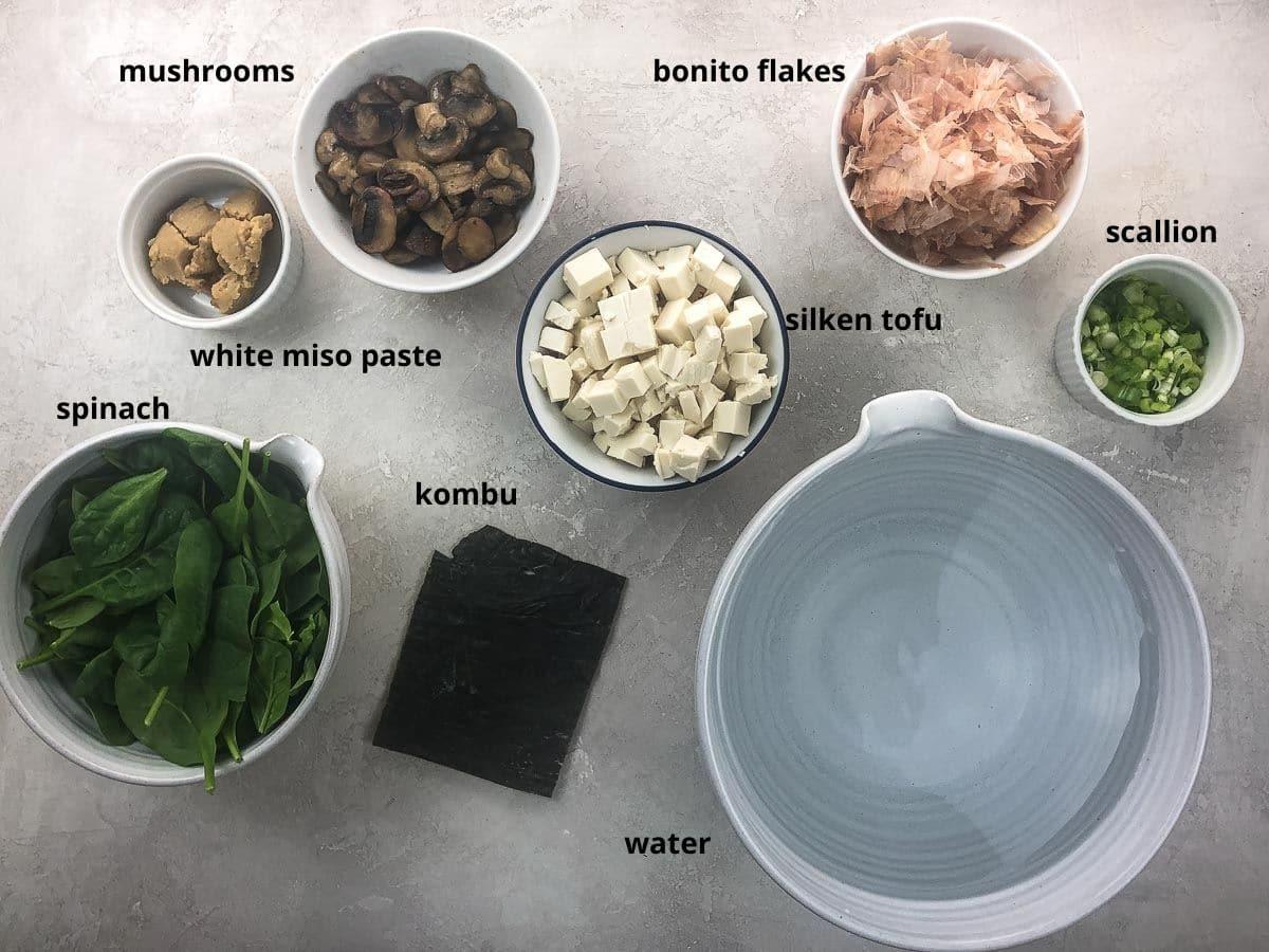 ingredients for making miso soup with sea anemone laid out on a counter