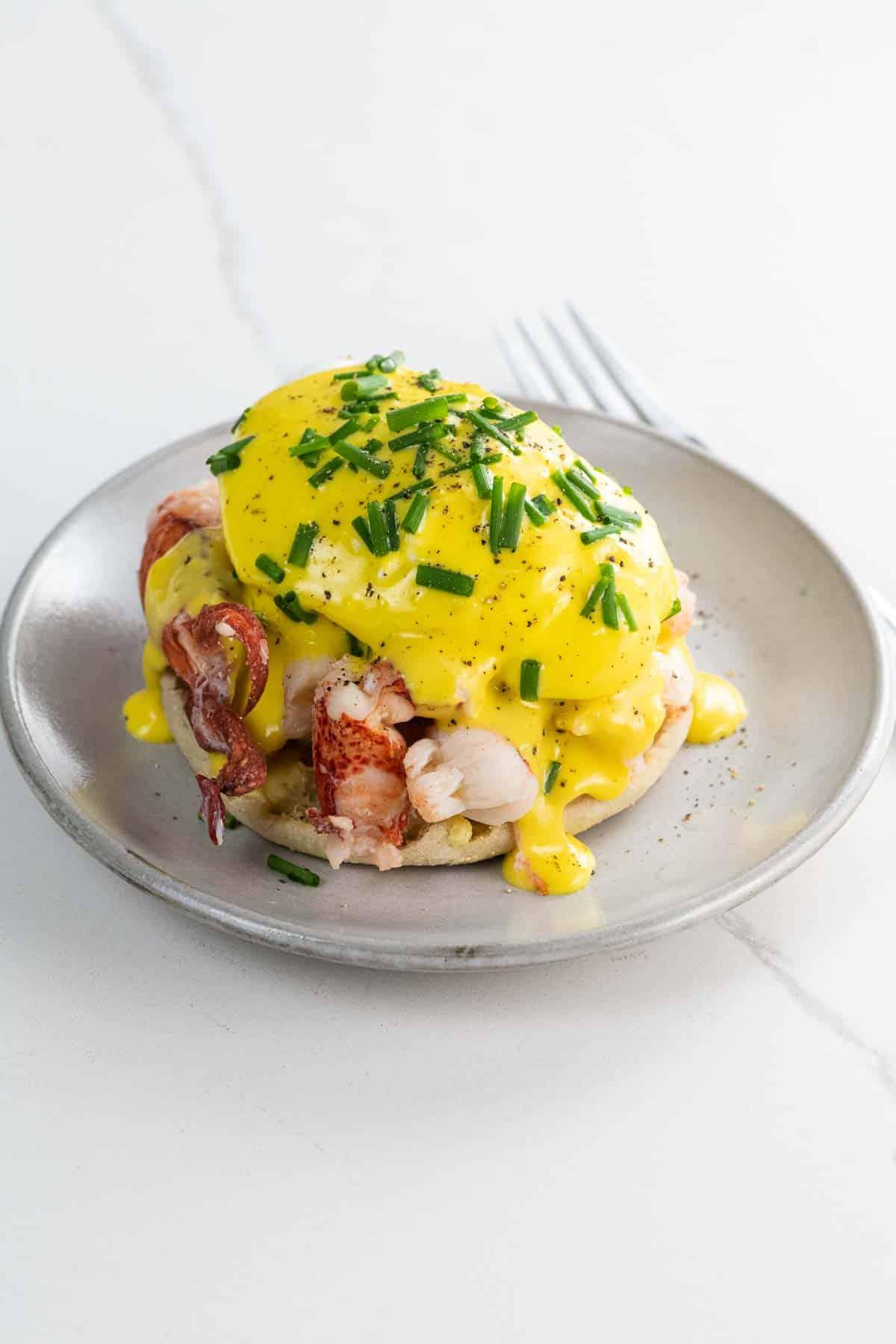 Lobster Benedict with Hollandaise Sauce plated beautifully