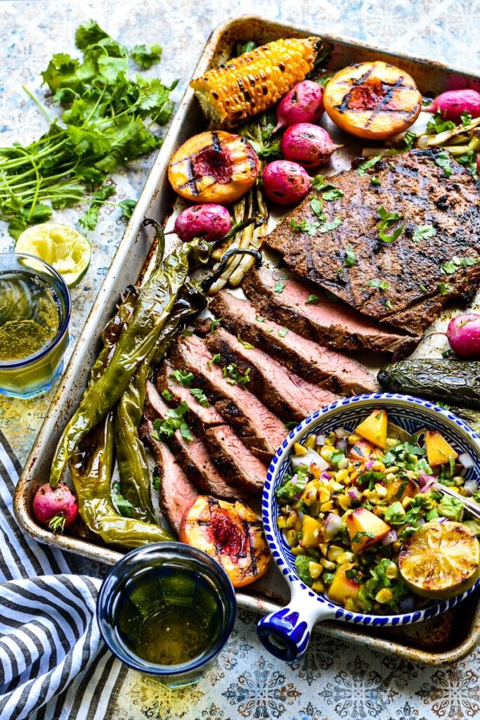 final presentation of grilled steak with peach salsa