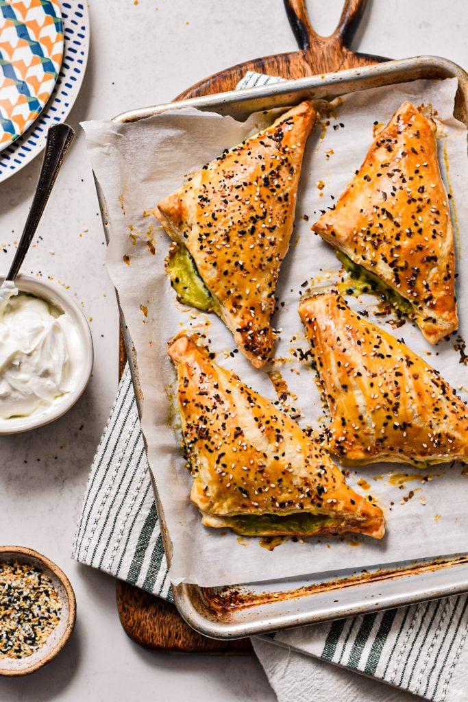 overhead shot of a freshly baked spanakopita with golden crust