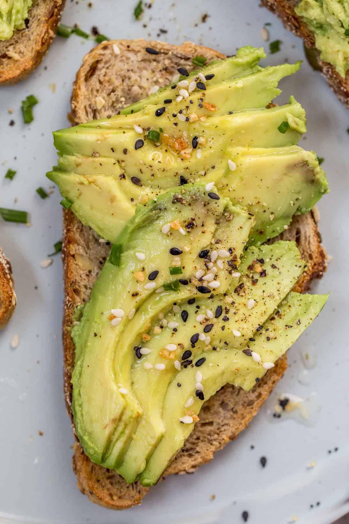 Close-up of assembling gravlax avocado toast