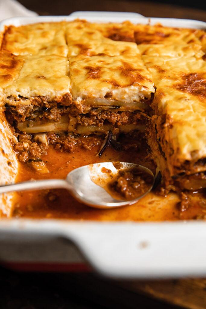 Close-up of the layers inside a Moussaka Grilled Cheese Sandwich