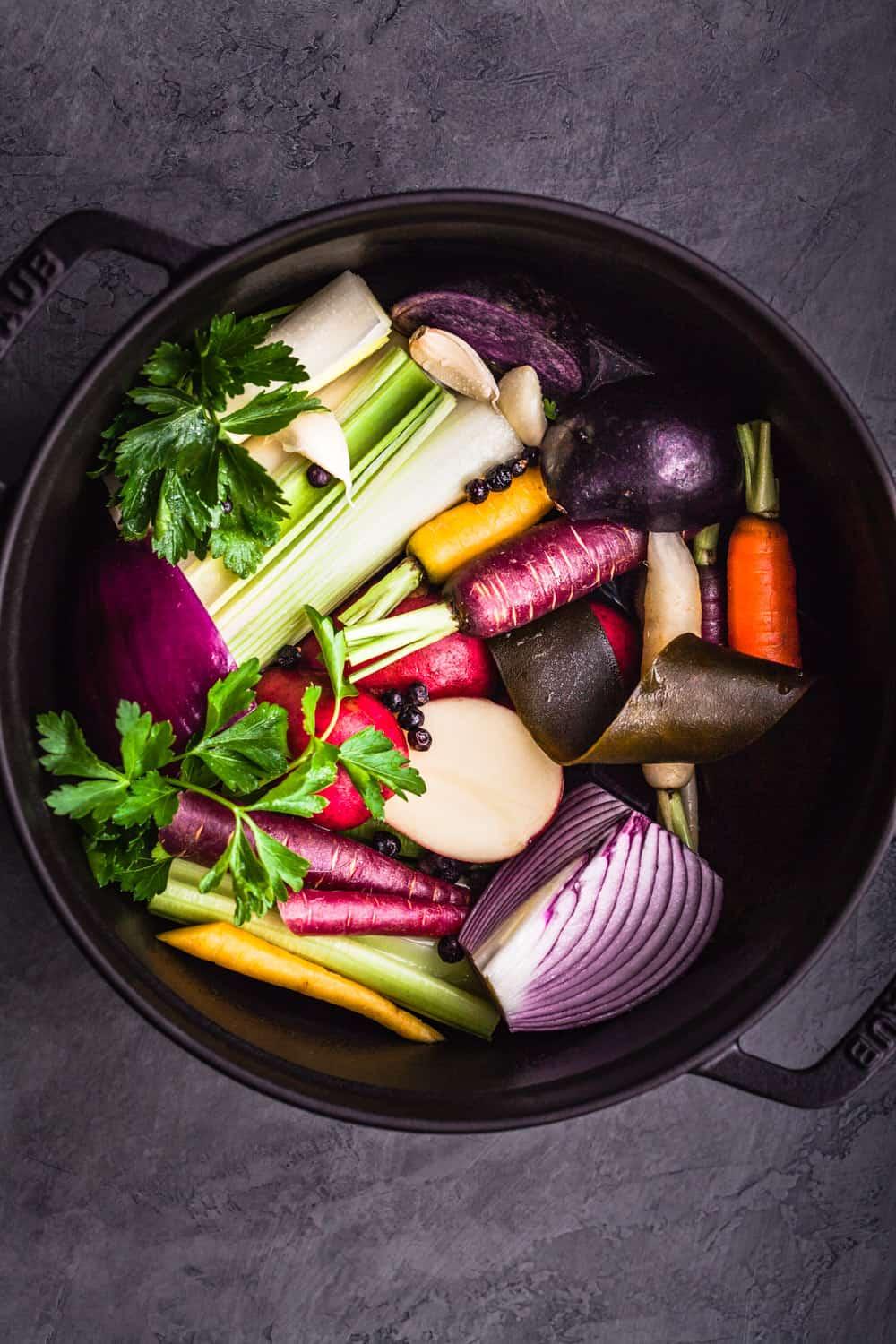 Stockpot filled with broth and vegetables