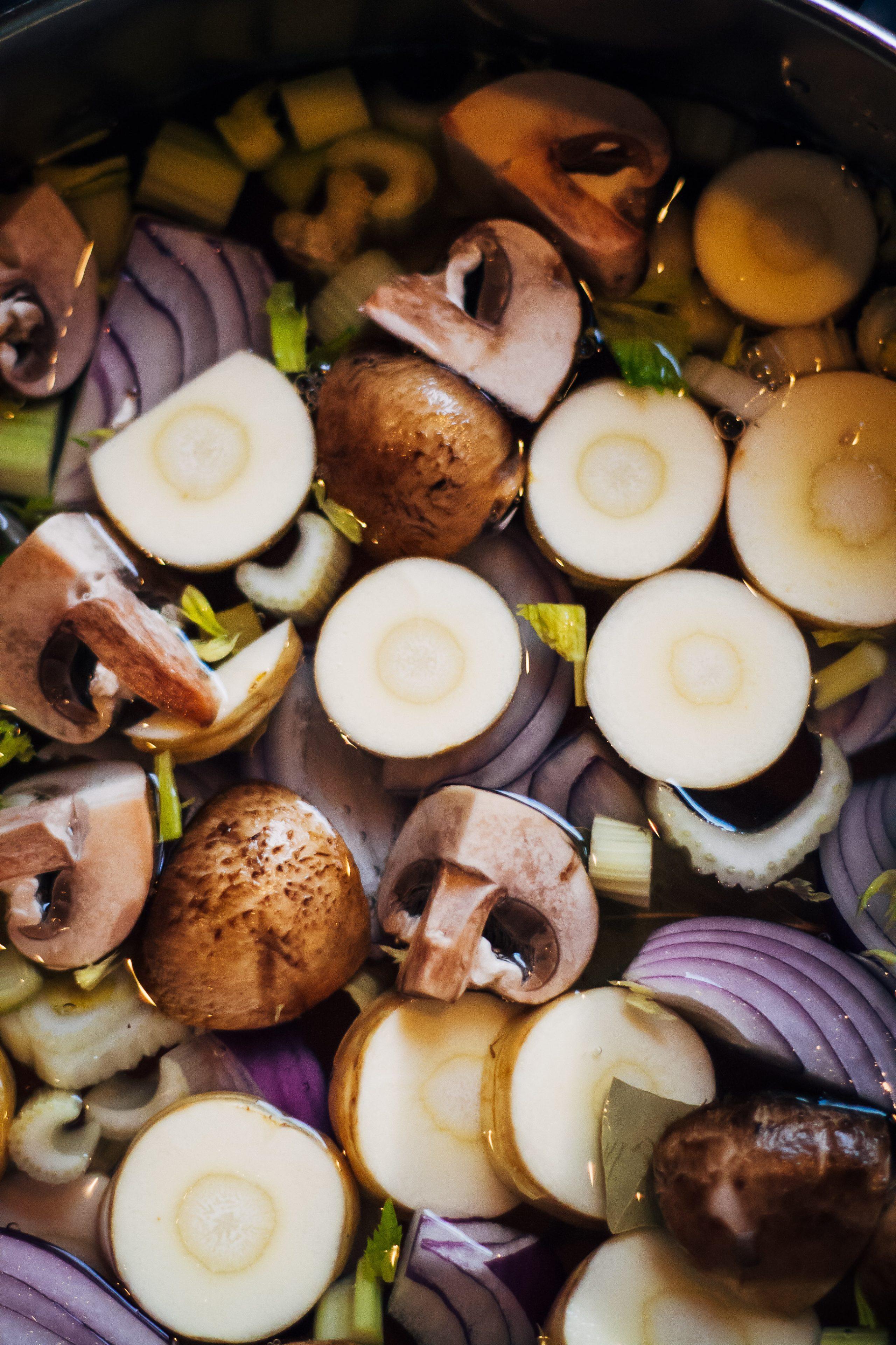 steaming pot of root vegetable broth