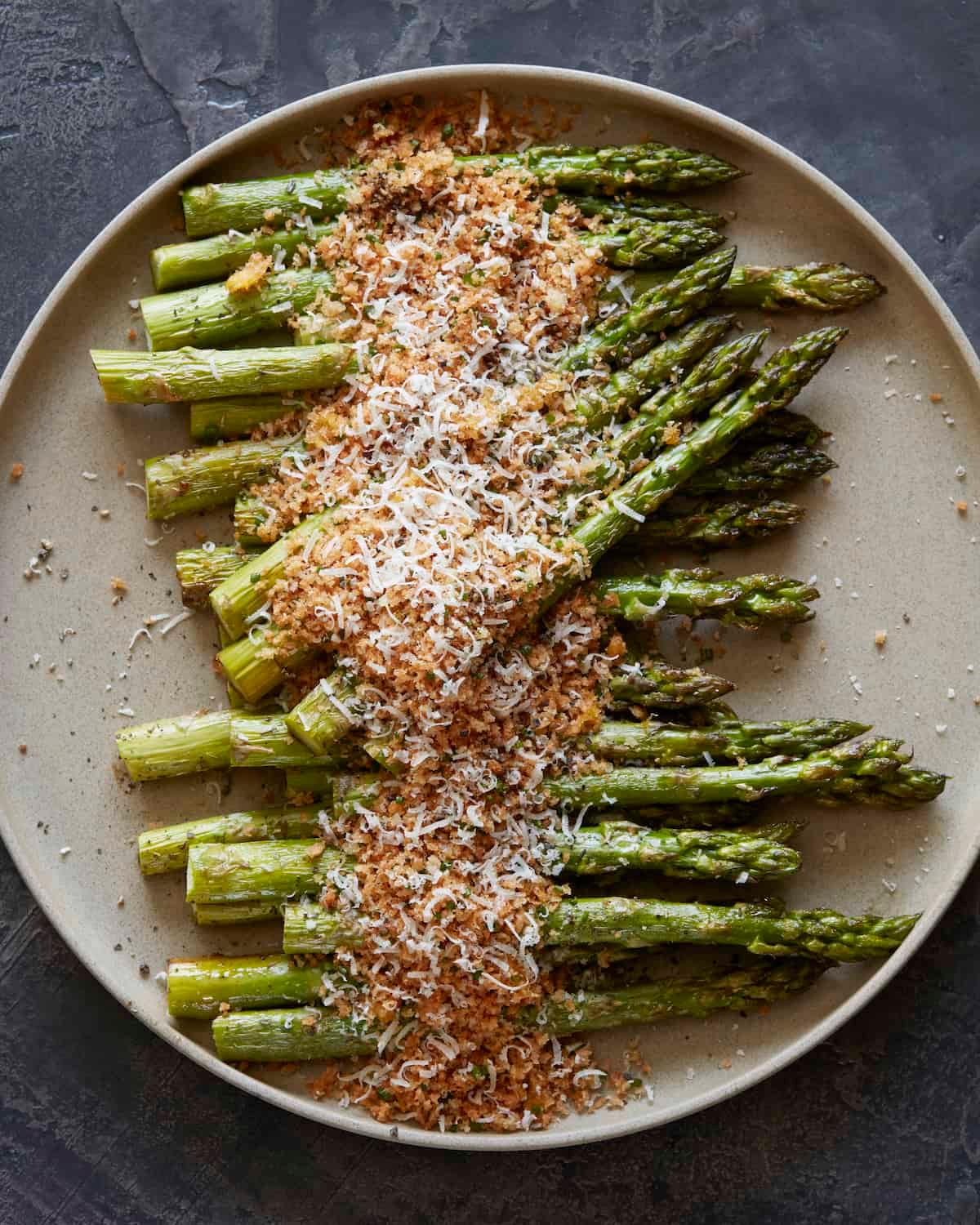 Close-up of baked asparagus tips turning golden brown