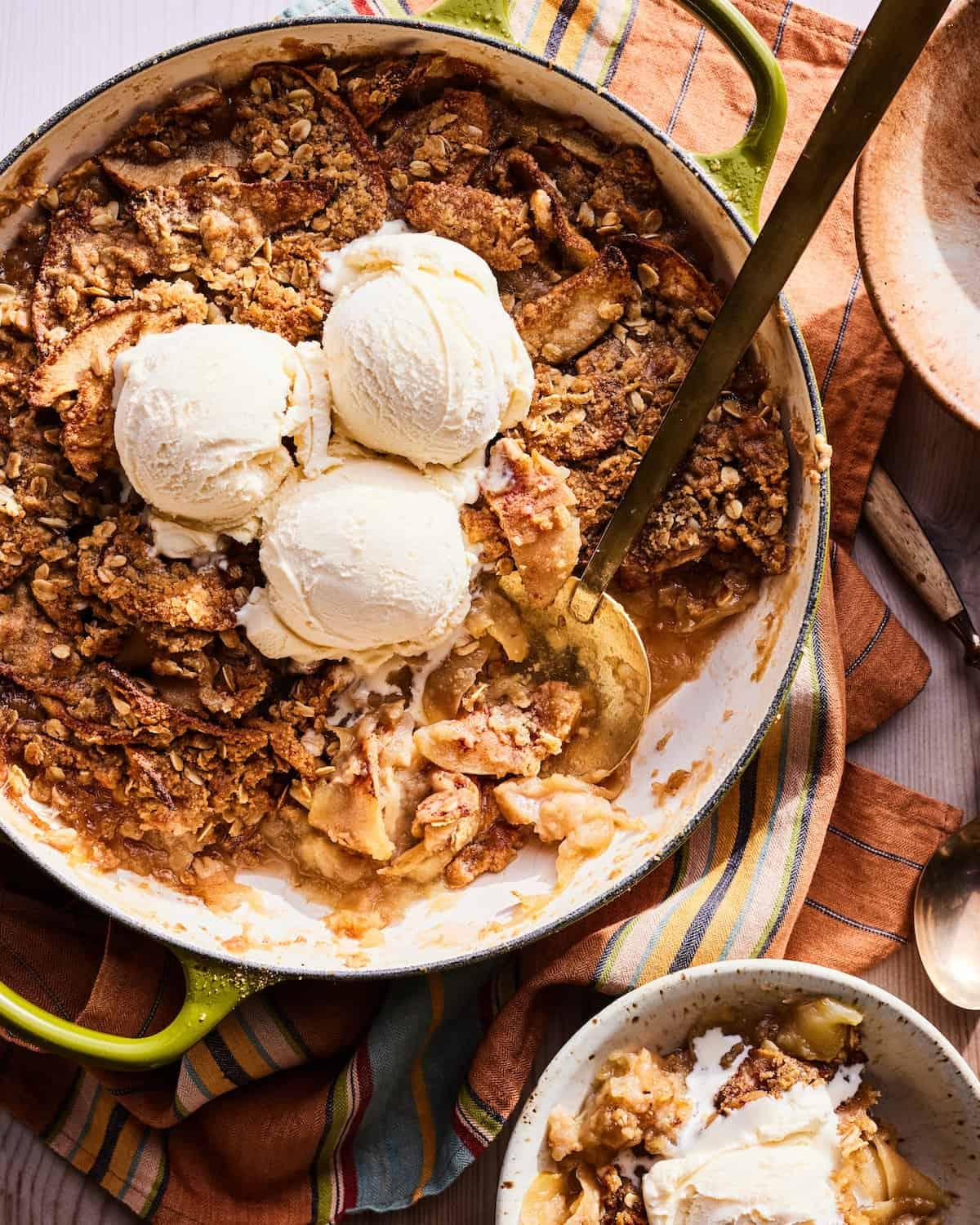 A rustic-style image showing the apple crisp cobbler being served with ice cream
