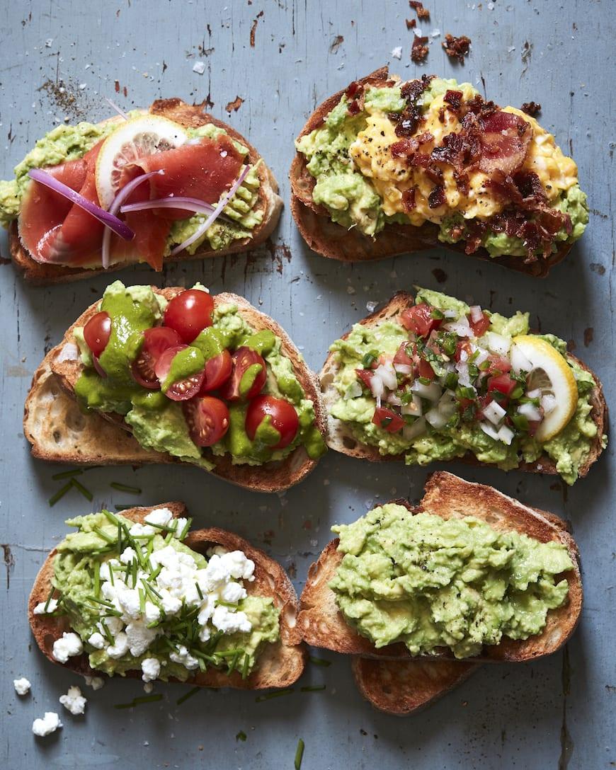 various toppings arranged around avocado egg toast