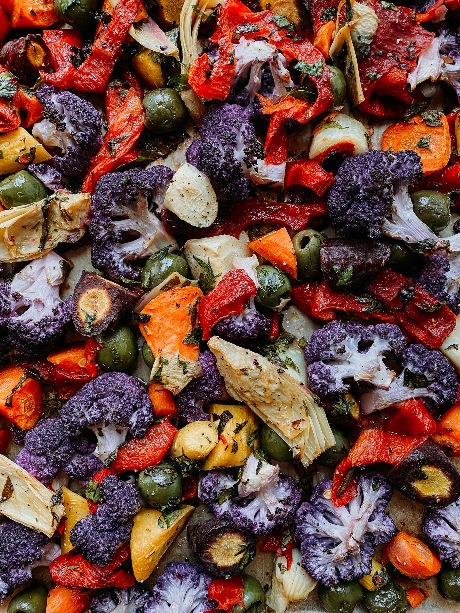 Close-up of colorful vegetables being roasted in an oven