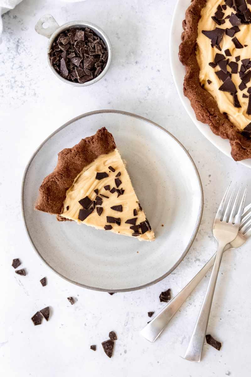 overhead shot of a perfect slice of peanut butter pie with chocolate shavings