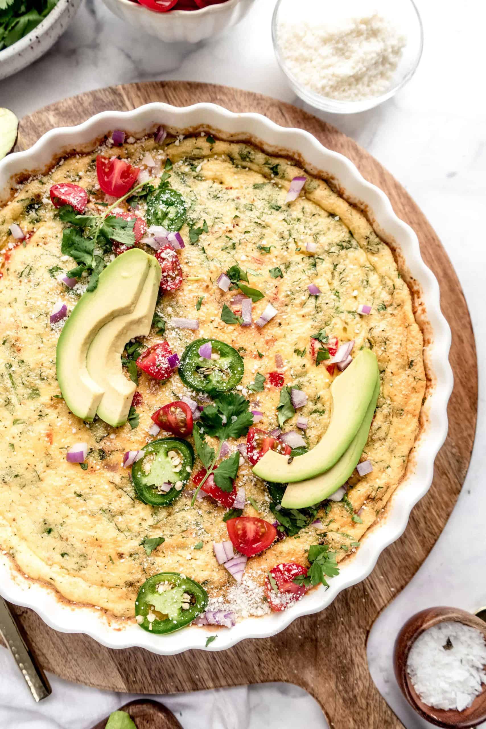 Close-up shot of the taco frittata being sliced and served