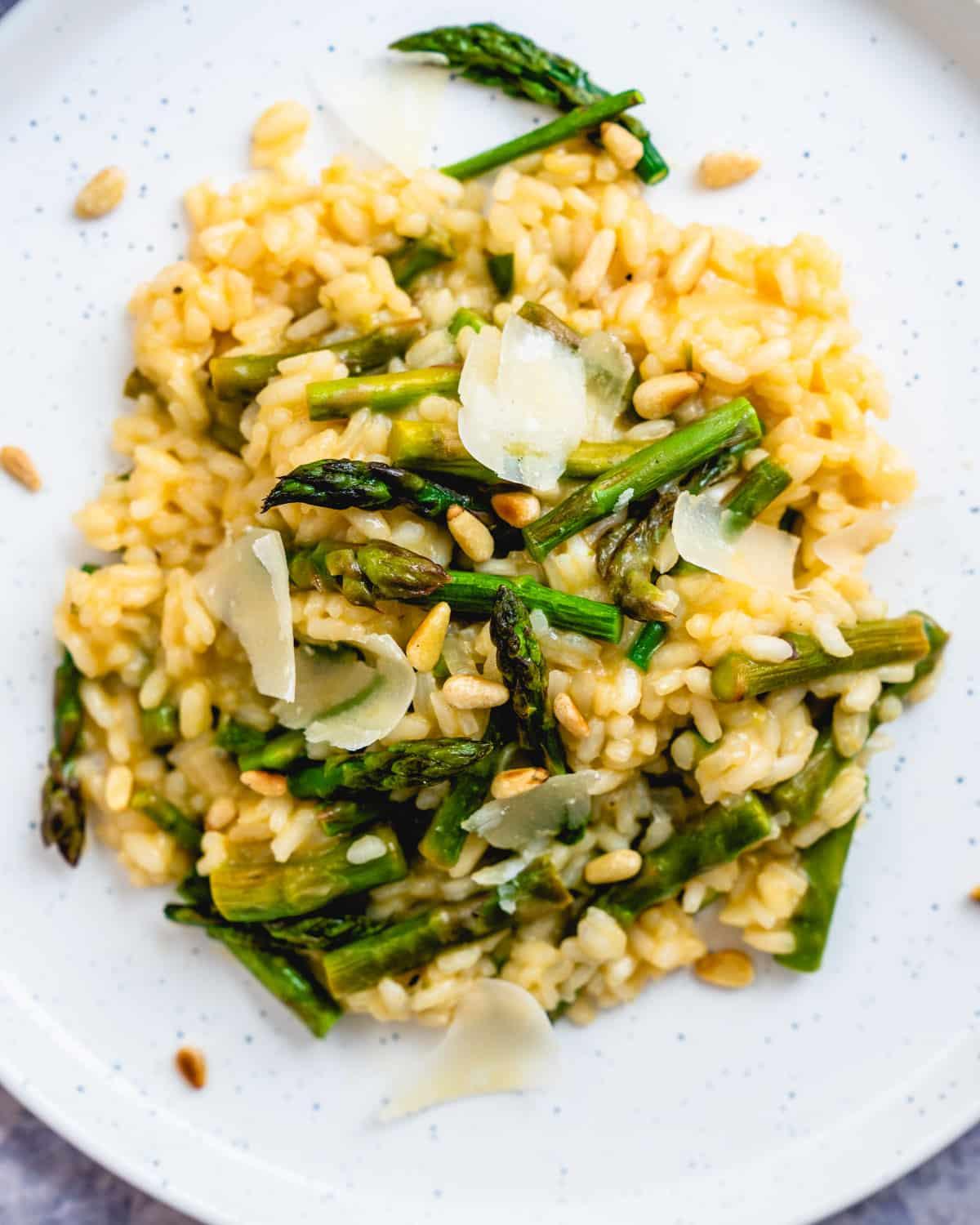 creamy asparagus risotto topped with toasted pine nuts and parmesan cheese