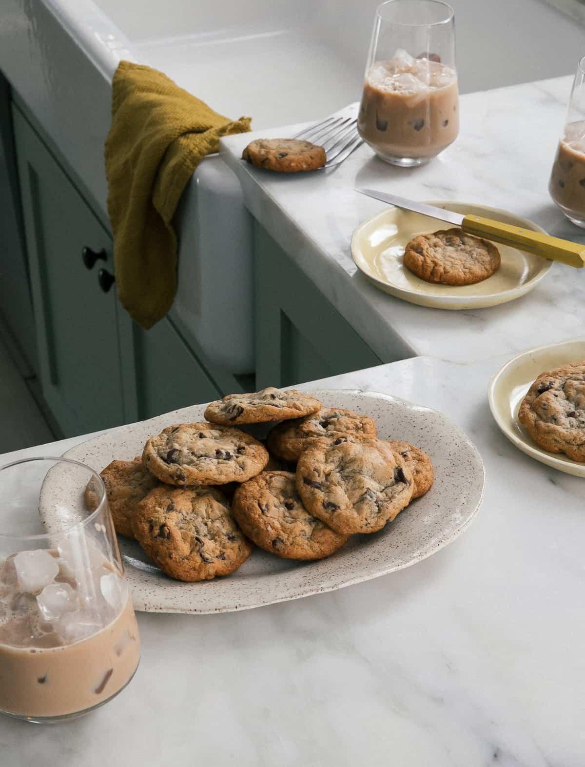 ingredients for banana bread chocolate chip cookies arranged on a kitchen counter
