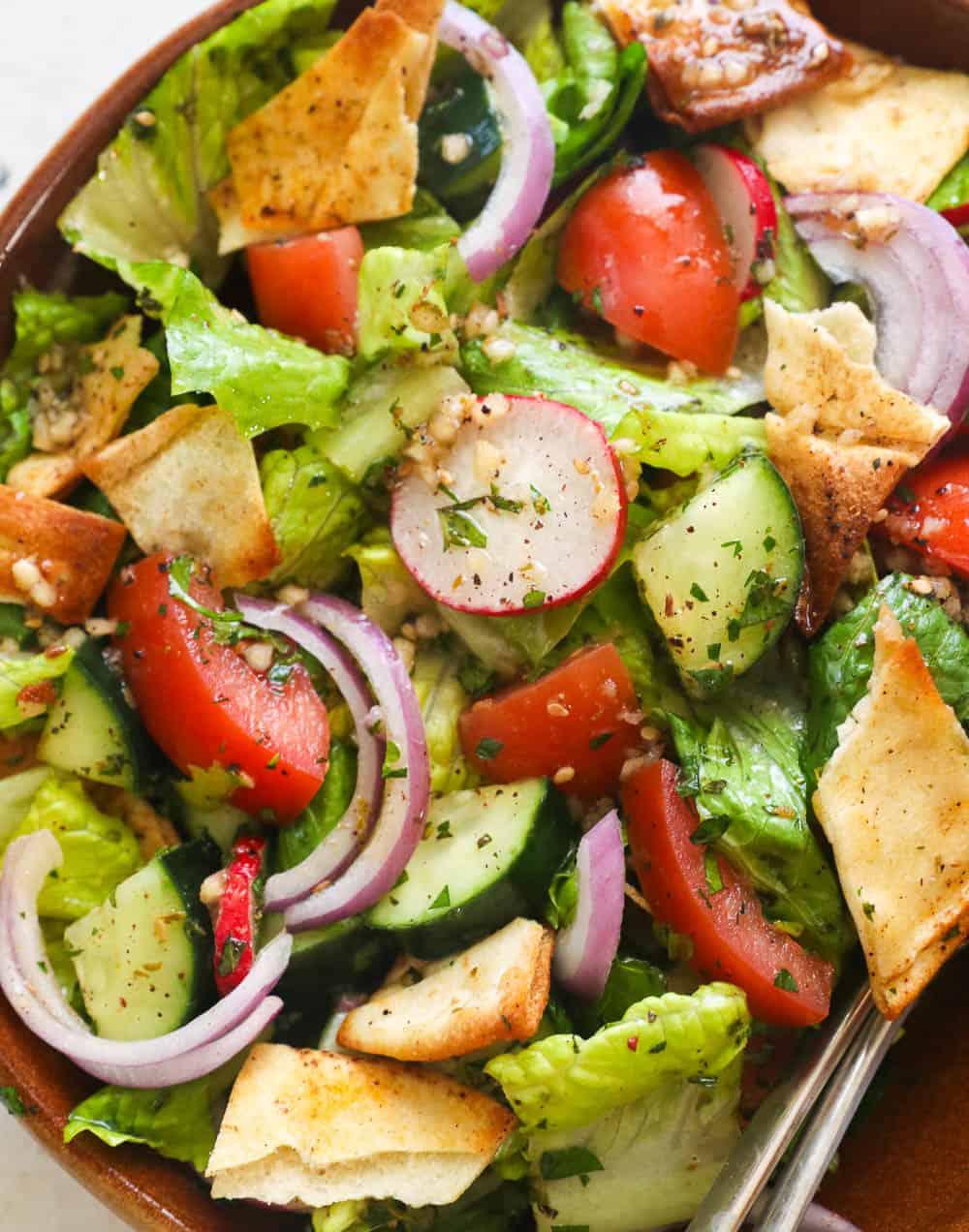 close up shot of mint and peanut fattoush salad with sesame