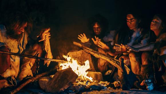 Ancient people cooking over fire