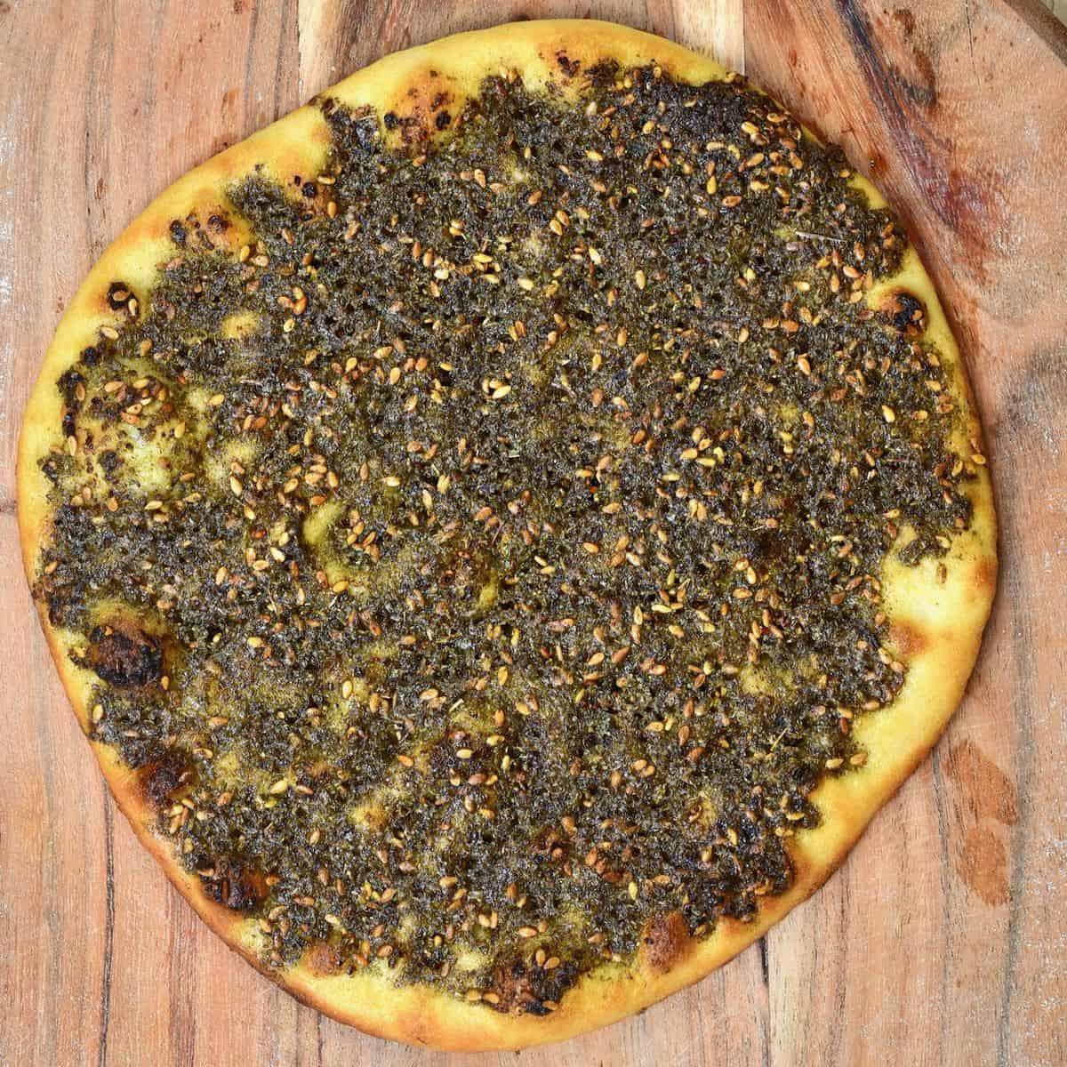 close-up of za'atar bread with herbs and spices visible
