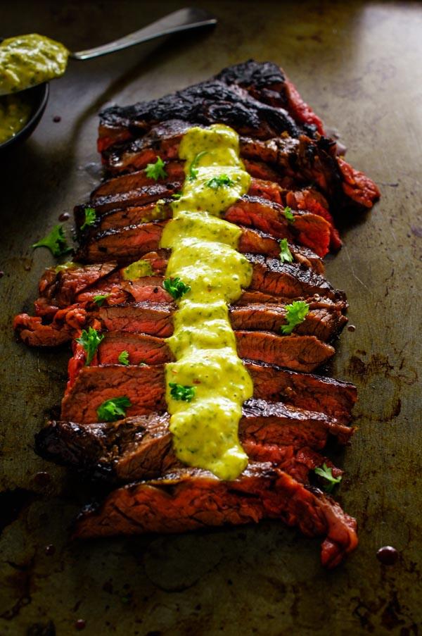 steak drizzled with aioli and served with paleo-friendly sides