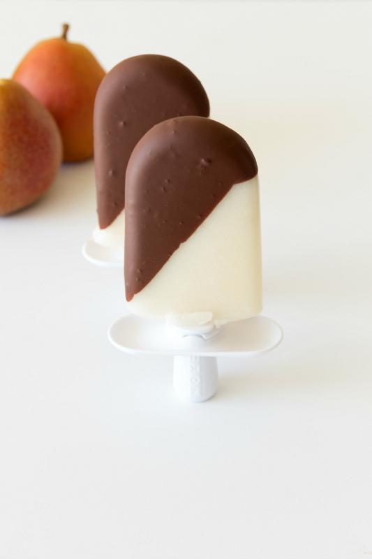 close up of pear popsicles with chocolate drizzle and sprinkles