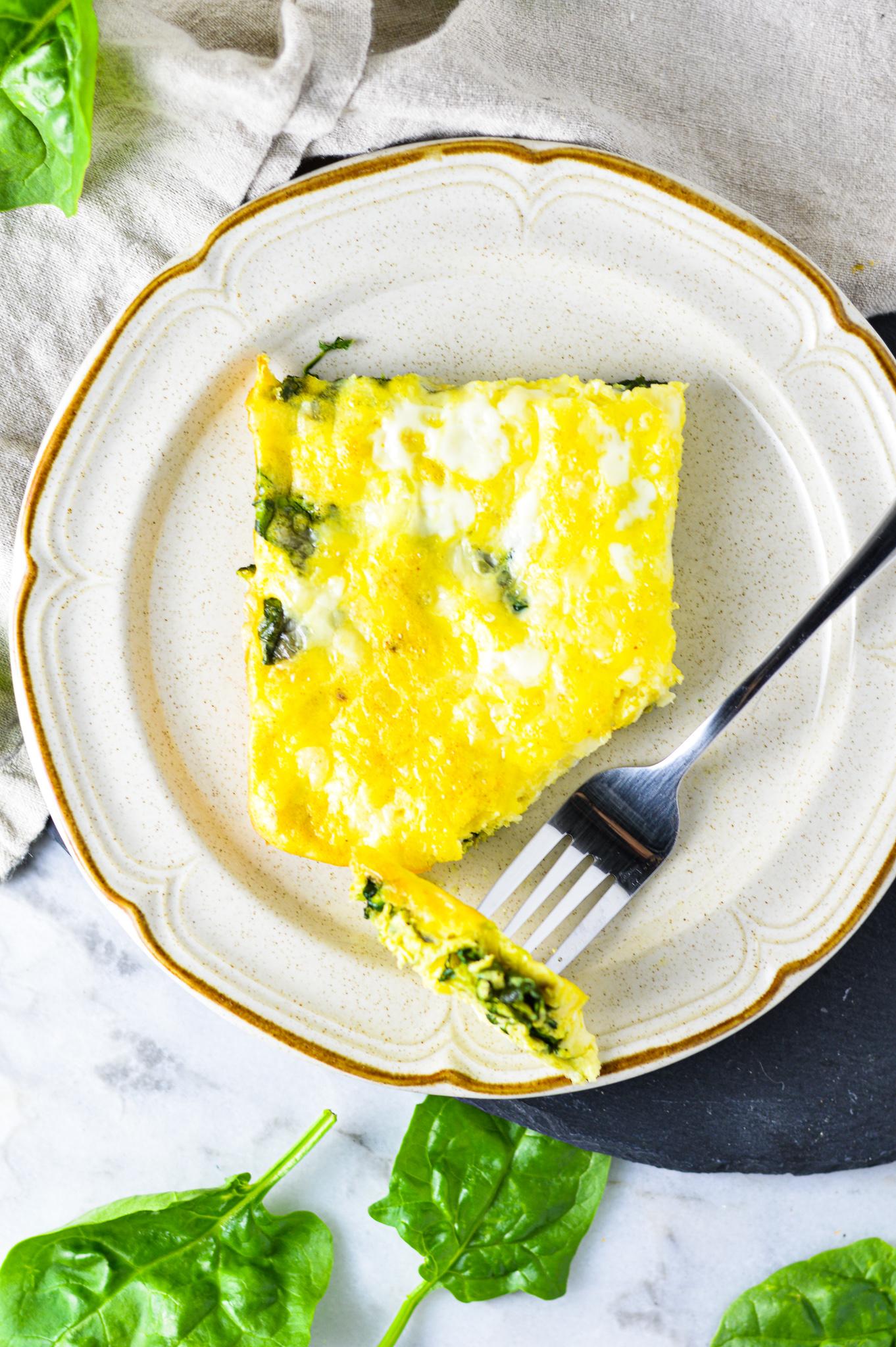 Close up of the ingredients: eggs, spinach, and mozzarella