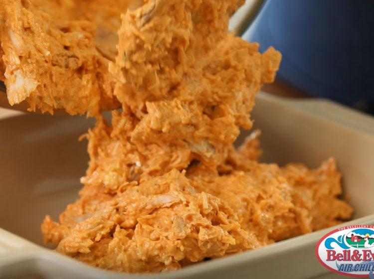 close-up shot of pretzel crusted buffalo chicken dip in a baking dish