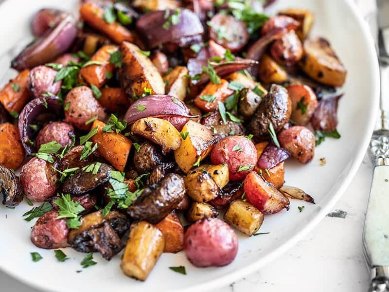 Close up of roasted root vegetables with balsamic glaze